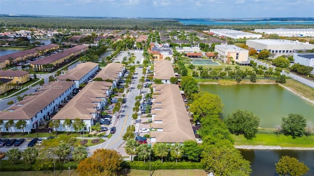 bird's eye view with a water view and a residential view