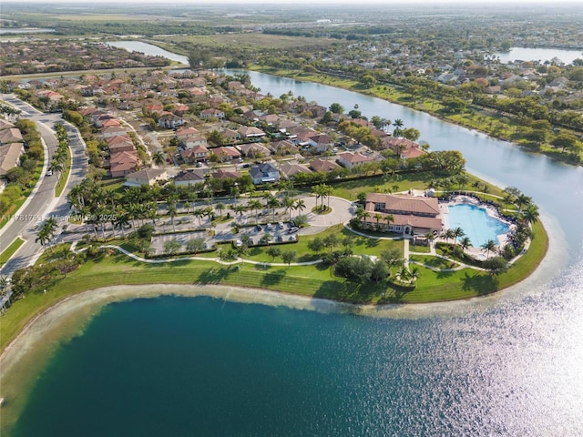 drone / aerial view with a residential view and a water view