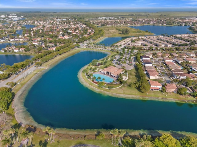 bird's eye view featuring a water view and a residential view
