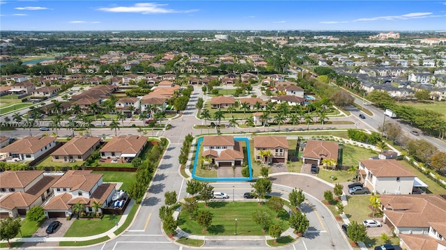 birds eye view of property with a residential view