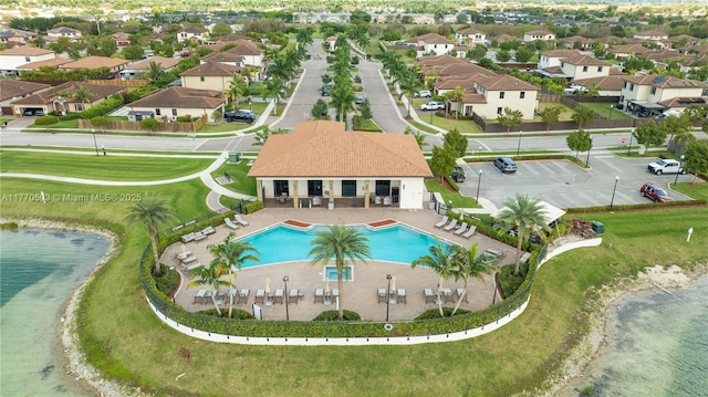 bird's eye view with a water view and a residential view