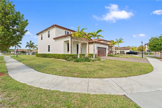 view of home's exterior featuring stucco siding, driveway, a tile roof, a garage, and a lawn