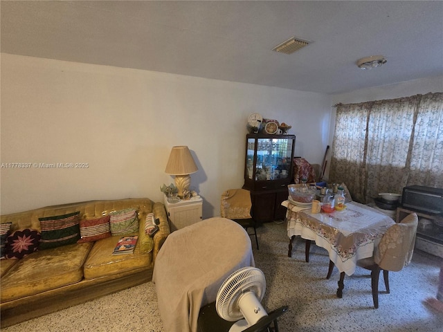 living area featuring visible vents