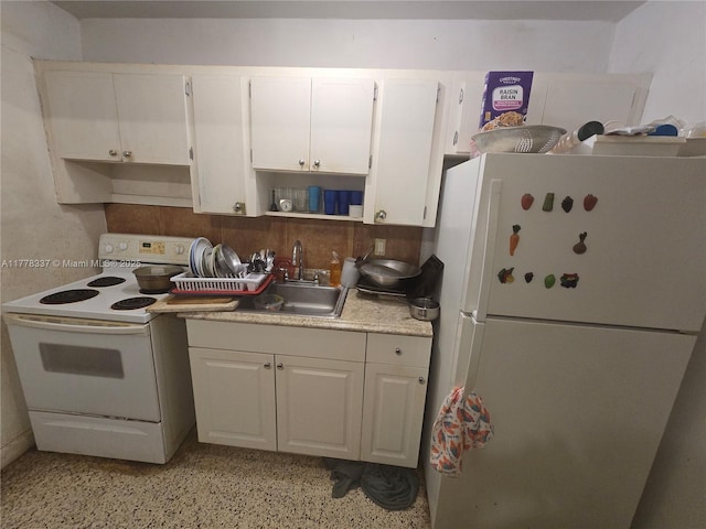kitchen featuring open shelves, a sink, light countertops, white appliances, and white cabinetry