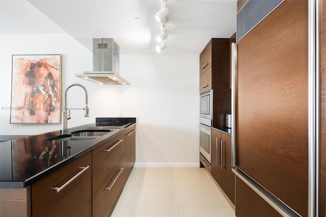 485 Brickell Ave Unit 4707, Miami, FL 33131 - kitchen featuring built in appliances, a sink, range hood, and modern cabinets