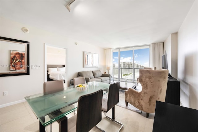 485 Brickell Ave Unit 4707, Miami, FL 33131 - dining area with expansive windows, baseboards, and light tile patterned floors