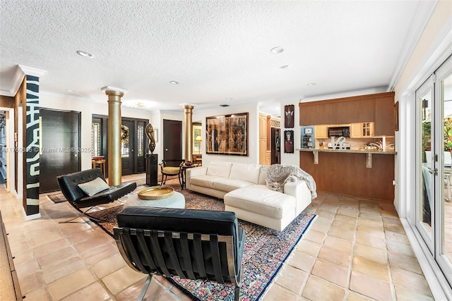 1414 Ferdinand St, Coral Gables, FL 33134 - living room with decorative columns, recessed lighting, a textured ceiling, and ornamental molding