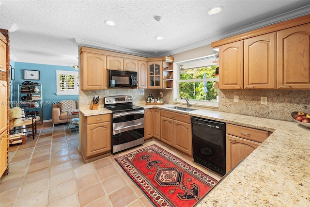 1414 Ferdinand St, Coral Gables, FL 33134 - kitchen with a sink, black appliances, crown molding, and a healthy amount of sunlight