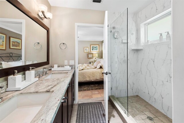 1414 Ferdinand St, Coral Gables, FL 33134 - full bathroom with double vanity, ensuite bathroom, a sink, and a marble finish shower