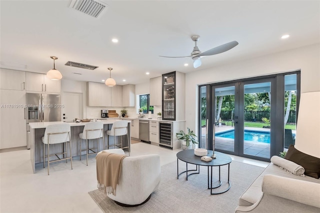 8360 SW 148th Dr, Palmetto Bay, FL 33158 - living room featuring wine cooler, ceiling fan, visible vents, and recessed lighting