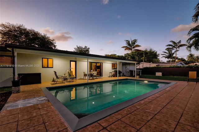 8360 SW 148th Dr, Palmetto Bay, FL 33158 - back of property with fence, a fenced in pool, a patio, and stucco siding