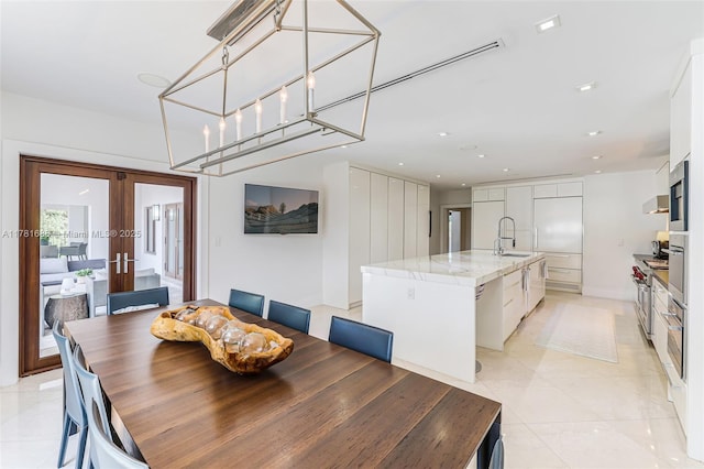 555 Arvida Pkwy, Coral Gables, FL 33156 - dining space with recessed lighting, french doors, and light tile patterned flooring