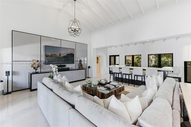 555 Arvida Pkwy, Coral Gables, FL 33156 - living room with high vaulted ceiling, beamed ceiling, and an inviting chandelier