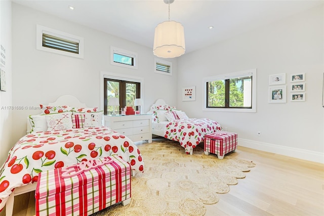 555 Arvida Pkwy, Coral Gables, FL 33156 - bedroom featuring recessed lighting, baseboards, multiple windows, and wood finished floors