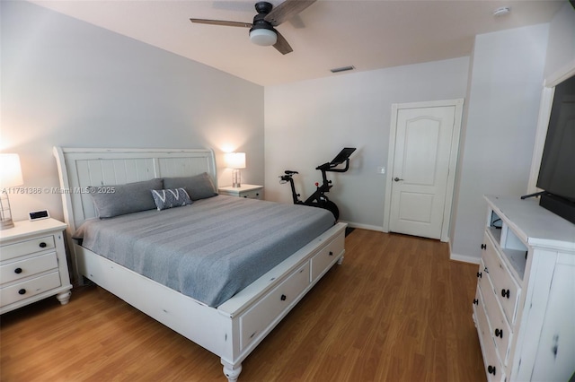 266 Iris Dr, Jupiter, FL 33458 - bedroom featuring wood finished floors, baseboards, a ceiling fan, and visible vents