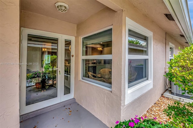 1237 NW 52nd Way, Deerfield Beach, FL 33442 - view of exterior entry featuring stucco siding
