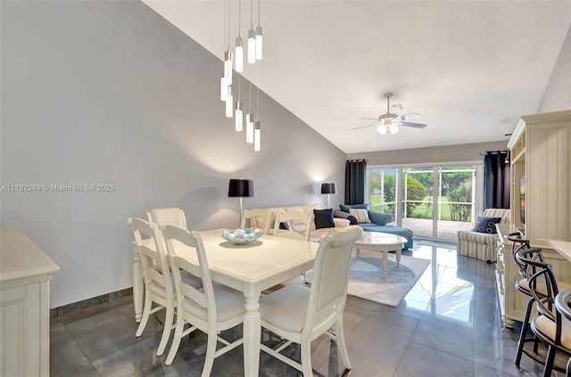 1237 NW 52nd Way, Deerfield Beach, FL 33442 - dining space featuring high vaulted ceiling, dark tile patterned floors, a ceiling fan, and baseboards