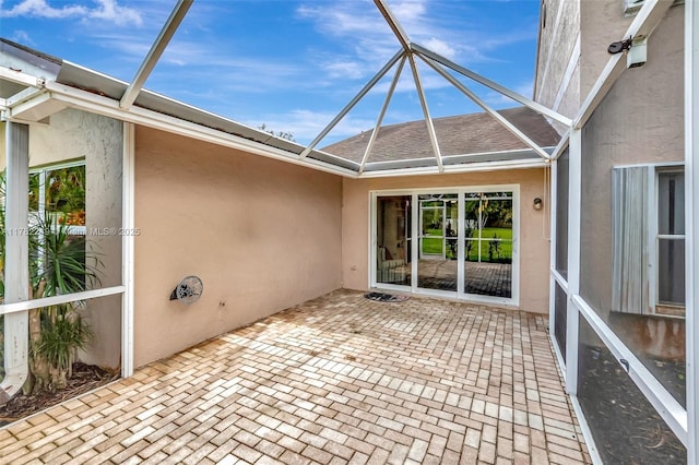 1237 NW 52nd Way, Deerfield Beach, FL 33442 - exterior space featuring a patio, stucco siding, roof with shingles, and glass enclosure