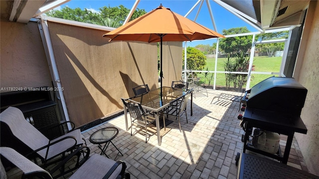 1237 NW 52nd Way, Deerfield Beach, FL 33442 - view of patio / terrace featuring outdoor dining space and glass enclosure
