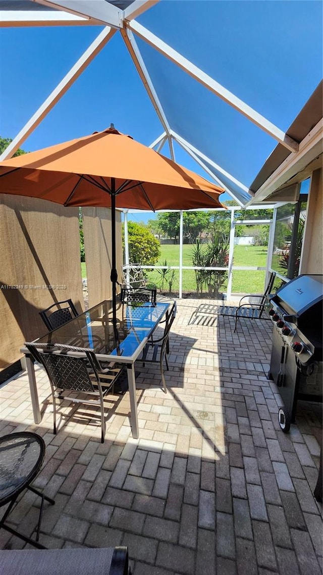 1237 NW 52nd Way, Deerfield Beach, FL 33442 - view of patio featuring glass enclosure
