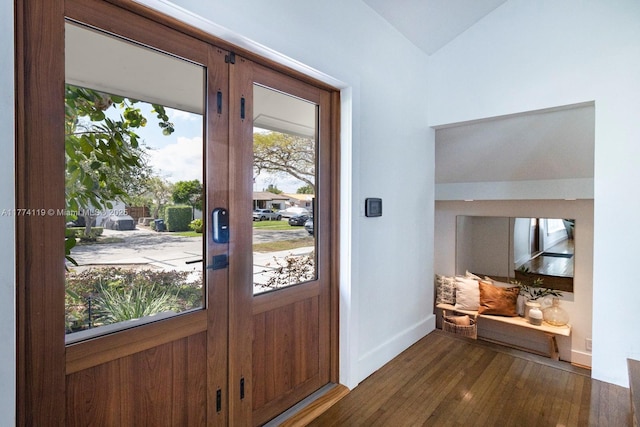 foyer featuring french doors, wood finished floors, and baseboards