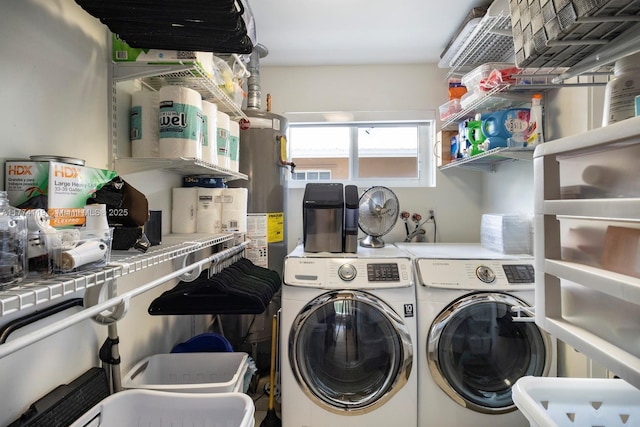 laundry area featuring gas water heater, washer and dryer, and laundry area