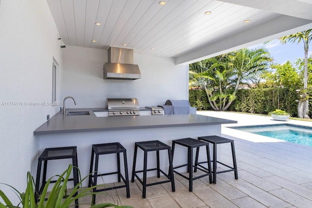 view of patio with a sink, grilling area, outdoor wet bar, and area for grilling