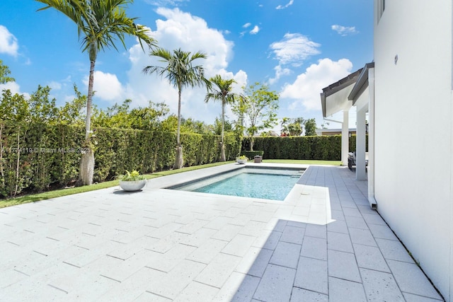 view of pool with a fenced in pool, a patio, and fence