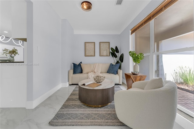 2272 NE 31st St, Lighthouse Point, FL 33064 - living area featuring marble look tiles and plenty of natural light