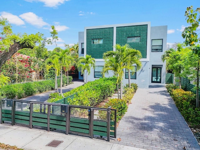 2735-2737 SW 2nd St, Miami, FL 33135 - view of front facade featuring fence private yard, french doors, and stucco siding