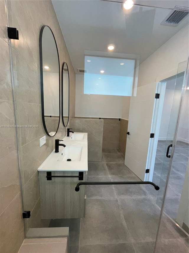 2735-2737 SW 2nd St, Miami, FL 33135 - bathroom featuring a sink, a stall shower, tile walls, and visible vents