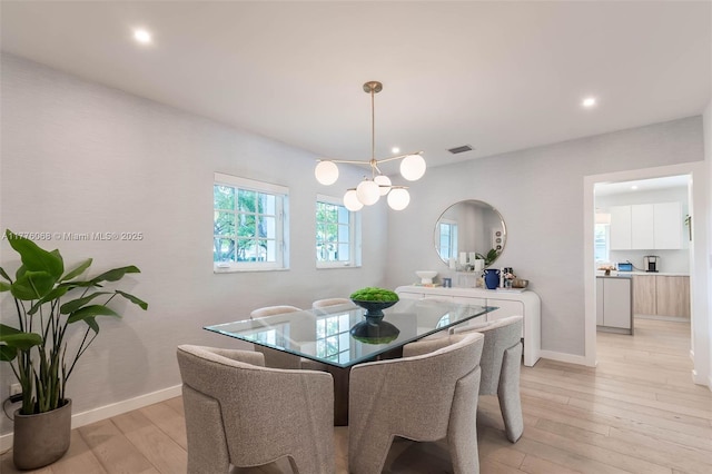 dining area featuring a chandelier, recessed lighting, visible vents, and light wood-type flooring