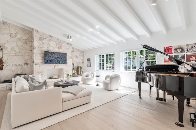 living room featuring wood finished floors and lofted ceiling with beams