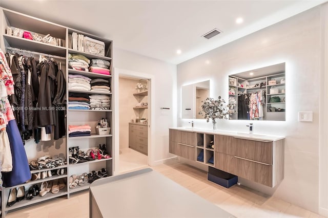 spacious closet with visible vents and light wood finished floors