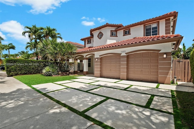 16477 SW 67th Ter, Miami, FL 33193 - mediterranean / spanish-style house with stucco siding, driveway, an attached garage, and a tiled roof