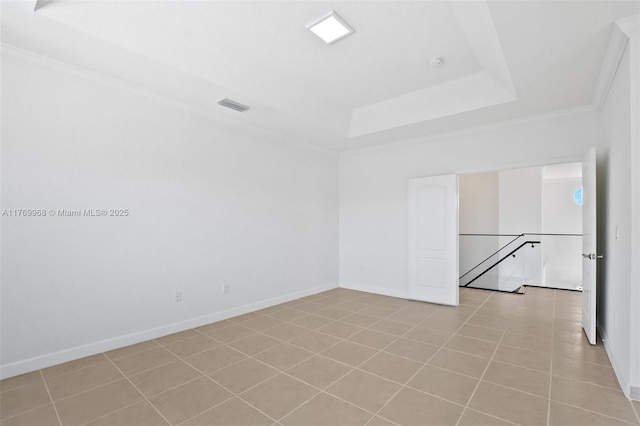 16477 SW 67th Ter, Miami, FL 33193 - spare room with crown molding, a raised ceiling, baseboards, and tile patterned flooring