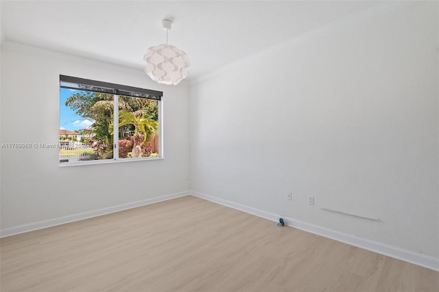 16477 SW 67th Ter, Miami, FL 33193 - spare room featuring light wood-style floors, baseboards, and crown molding