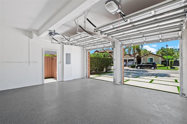 16477 SW 67th Ter, Miami, FL 33193 - garage featuring a garage door opener and electric panel