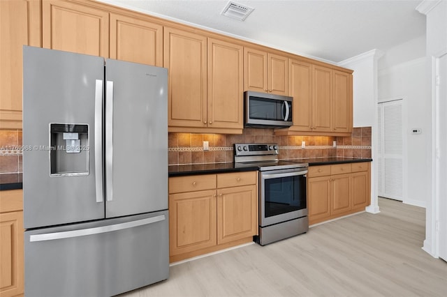 16477 SW 67th Ter, Miami, FL 33193 - kitchen featuring appliances with stainless steel finishes, dark countertops, decorative backsplash, light wood-style floors, and crown molding