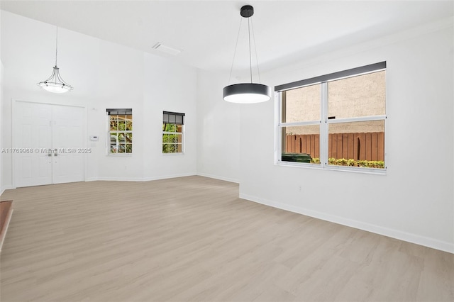 16477 SW 67th Ter, Miami, FL 33193 - spare room with light wood-style flooring and baseboards