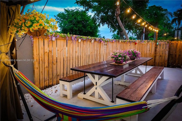 16101 SW 104th Ter, Miami, FL 33196 - view of patio / terrace featuring a fenced backyard and outdoor dining space