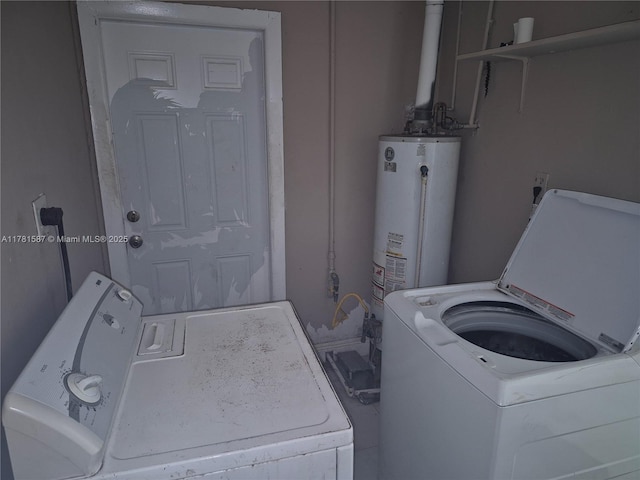 washroom with independent washer and dryer, laundry area, and gas water heater