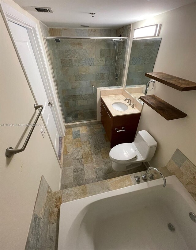 2681 N Flamingo Rd Unit 302S, Sunrise, FL 33323 - bathroom featuring toilet, a bath, a stall shower, vanity, and stone finish flooring