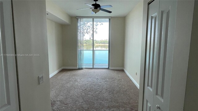 2681 N Flamingo Rd Unit 302S, Sunrise, FL 33323 - carpeted spare room with expansive windows, baseboards, and a ceiling fan