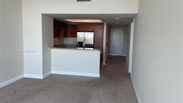 2681 N Flamingo Rd Unit 302S, Sunrise, FL 33323 - kitchen with visible vents, baseboards, stainless steel fridge, a peninsula, and light carpet