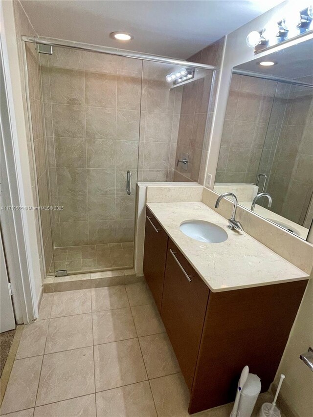 2681 N Flamingo Rd Unit 302S, Sunrise, FL 33323 - bathroom with vanity, tile patterned flooring, a stall shower, and recessed lighting