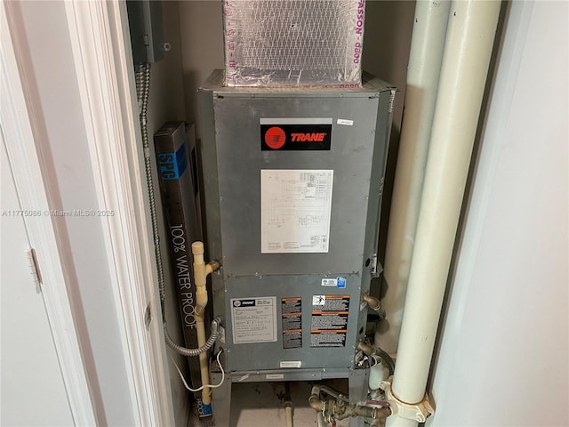 utility room with heating unit