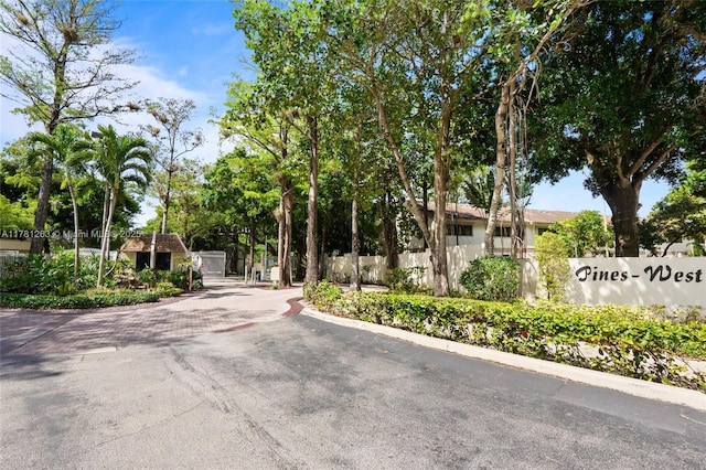 3062 S Oakland Forest Dr Unit 205, Oakland Park, FL 33309 - view of road featuring a gated entry