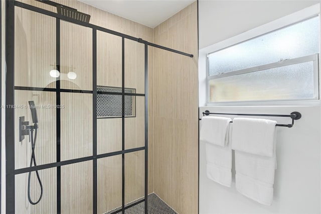 full bath featuring tiled shower