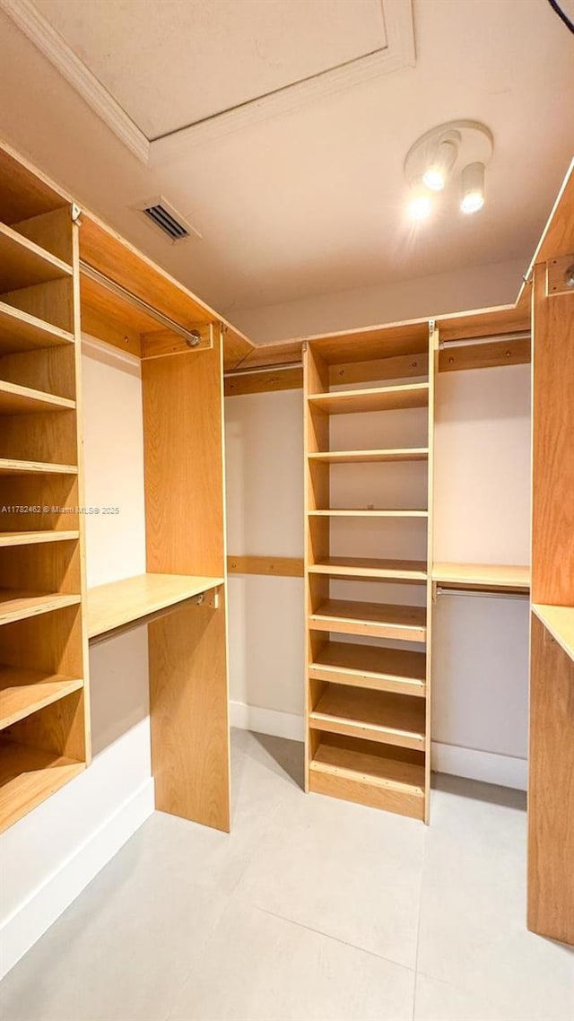 spacious closet featuring tile patterned flooring and visible vents